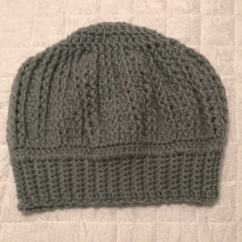 Handmade Crochet hat. Never worn. Grey in color.